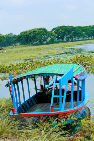 Boat on the water in the countryside of Bangladesh, Asia.