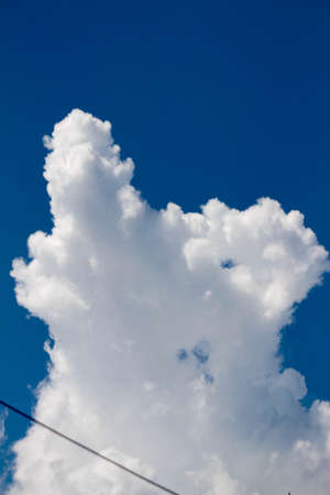 White fluffy clouds in the blue sky. White fluffy clouds in the blue sky.の写真素材