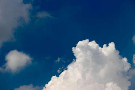 White clouds in the blue sky. Natural background with copy space.