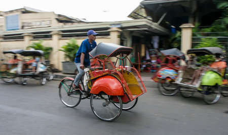 YOGYAKARTA, INDONESIA - APRIL 29, 2008: Trishaw or Becak at Yogyakarta town.