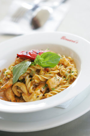 KUALA LUMPUR, MALAYSIA - JUNE 09, 2006: Twisted pasta seafood.のeditorial素材