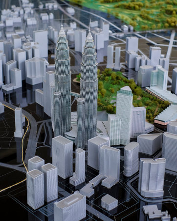 KUALA LUMPUR, MALAYSIA - AUGUST 10, 2016: Scale model of a city showing the Petronas Twin Towers....
