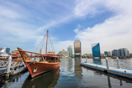 Traditional arabic Dhow at Dubai Creek, United Arab Emirates (UAE). Dubai Creek are one of famous place in Dubai with boat taxi activity.のeditorial素材