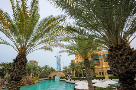 View of Burj Al Arab (Tower of the Arabs) hotel from Madinat Jumeirah hotel, Dubai. Madinat is a luxury resort which includes hotels and souk spreding across over 40 hectars.のeditorial素材
