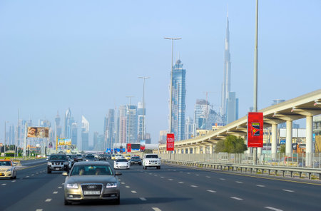 DUBAI, UNITED ARAB EMIRATES (UAE) - APRIL 13, 2012: Dubai city road with the view of Burj Khalifa. Dubai is the fastest growing city in the world.のeditorial素材