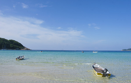 Boat at crystal clear waters Perhentian Kecil Island beach, Terengganu, Malaysia.の写真素材