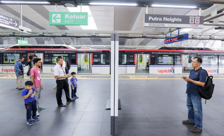 KUALA LUMPUR, MALAYSIA - JUNE 30, 2016 : People using at the Light Railway Transit (LRT) Putra Heights station. Transportation for future generation.のeditorial素材