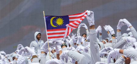 KUALA LUMPUR, MALAYSIA - AUGUST 31, 2016 : Hand waving Malaysia flag also known as Jalur Gemilang. People fly the flag in conjunction with the Independence Day celebration or Merdeka Day on 31 August and Hari Malaysia on 16 September.のeditorial素材