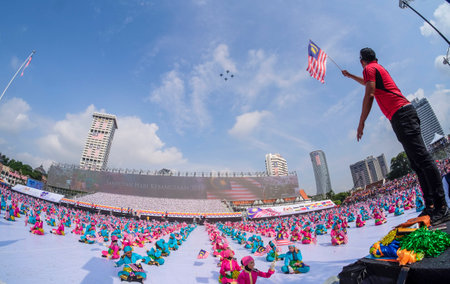 KUALA LUMPUR, MALAYSIA - AUGUST 31, 2016 : Performers waving Malaysia flag also known as Jalur Gemilang during Independence Day celebration or Merdeka Day at Merdeka Square.のeditorial素材