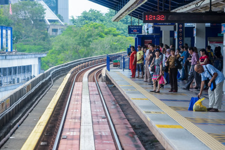 KUALA LUMPUR, MALAYSIA - SEPTEMBER 12, 2017 : People commute with Malaysia Light Railway Transit...