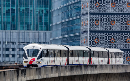 KUALA LUMPUR, MALAYSIA - SEPTEMBER 12, 2017 : Malaysia Light Railway Transit (LRT) train operated by Rapid Rail or service brand RapidKL. People commute with LRT as transportation to work and shopping.のeditorial素材