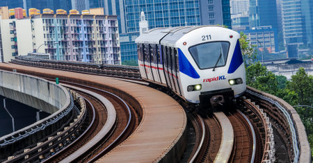 KUALA LUMPUR, MALAYSIA - SEPTEMBER 12, 2017 : Malaysia Light Railway Transit (LRT) train operated by Rapid Rail or service brand RapidKL. People commute with LRT as transportation to work and shopping.のeditorial素材