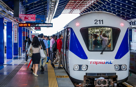 KUALA LUMPUR, MALAYSIA - SEPTEMBER 12, 2017 : Malaysia Light Railway Transit (LRT) train operated by Rapid Rail or service brand RapidKL. People commute with LRT as transportation to work and shopping.のeditorial素材