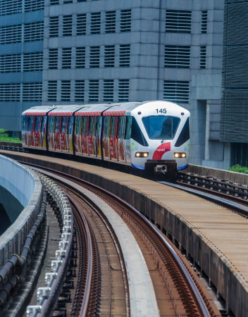 KUALA LUMPUR, MALAYSIA - SEPTEMBER 12, 2017 : Malaysia Light Railway Transit (LRT) train operated by Rapid Rail or service brand RapidKL. People commute with LRT as transportation to work and shopping.のeditorial素材