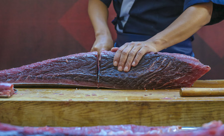 Fresh Tuna fish cut by professional Japanese chef. Tuna can be a good source of omega - 3 fatty acids.の写真素材