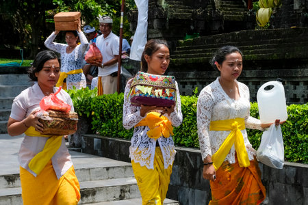 BALI, INDONESIA - NOVEMBER 15, 2017 : Balinese women in traditional clothes during religious ceremony at Tanah Lot temple, Bali.のeditorial素材