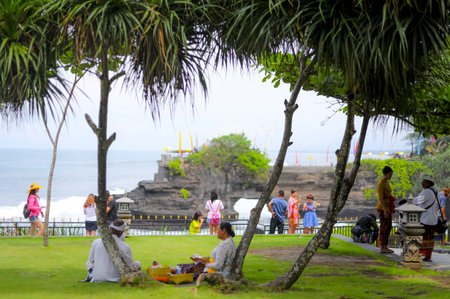 BALI, INDONESIA - NOVEMBER 15, 2017 : People during religious ceremony at Tanah Lot temple, Bali.のeditorial素材
