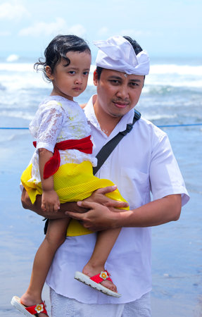 BALI, INDONESIA - NOVEMBER 15, 2017 : Balinese people in traditional clothes during religious ceremony at Tanah Lot temple, Bali.のeditorial素材