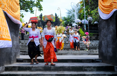 BALI, INDONESIA - NOVEMBER 15, 2017 : Balinese women in traditional clothes during religious ceremony at Tanah Lot temple, Bali.のeditorial素材