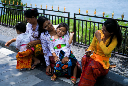 BALI, INDONESIA - NOVEMBER 15, 2017 : Balinese people in traditional clothes during religious ceremony at Tanah Lot temple, Bali.のeditorial素材
