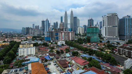 KUALA LUMPUR, MALAYSIA - JULY 18, 2018 : Kuala Lumpur skyline with view of Kampung Baru. Kampung Baru is a traditional village in Kuala Lumpur city centre.のeditorial素材