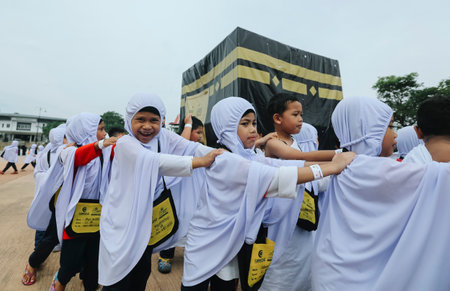 KUALA LUMPUR, MALAYSIA - JULY 12, 2018 : Muslim kids during an educational simulation of the Hajj pilgrimage. Little Hajjのeditorial素材