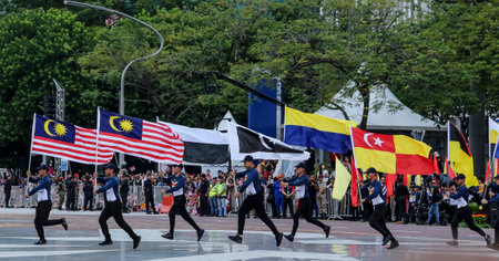 PUTRAJAYA, MALAYSIA - AUGUST 31, 2018 : Participant carry Jalur Gemilang flag during National Day celebration parade in Putrajaya. Celebrating the 61th anniversary of independence or Merdeka Day.のeditorial素材
