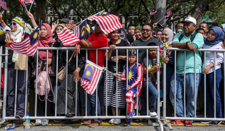 PUTRAJAYA, MALAYSIA - AUGUST 31, 2018 : Malaysian waving Jalur Gemilang flag during National Day celebration parade in Putrajaya. Celebrating the 61th anniversary of independence or Merdeka Day.のeditorial素材