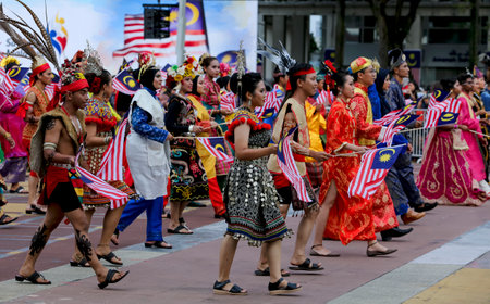 PUTRAJAYA, MALAYSIA - AUGUST 31, 2018 : Participant waving Jalur Gemilang flag during National Day celebration parade in Putrajaya. Celebrating the 61th anniversary of independence or Merdeka Day.のeditorial素材