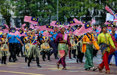 PUTRAJAYA, MALAYSIA - AUGUST 31, 2018 : Participant waving Jalur Gemilang flag during National Day celebration parade in Putrajaya. Celebrating the 61th anniversary of independence or Merdeka Day.のeditorial素材