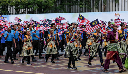 PUTRAJAYA, MALAYSIA - AUGUST 31, 2018 : Participant waving Jalur Gemilang flag during National Day celebration parade in Putrajaya. Celebrating the 61th anniversary of independence or Merdeka Day.のeditorial素材