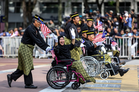 PUTRAJAYA, MALAYSIA - AUGUST 31, 2018 : Participant waving Jalur Gemilang flag during National Day celebration parade in Putrajaya. Celebrating the 61th anniversary of independence or Merdeka Day.のeditorial素材