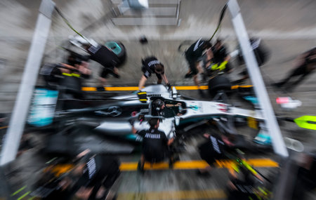SEPANG, MALAYSIA - SEPTEMBER 28, 2017 : Team members of Mercedes British driver Lewis Hamilton...