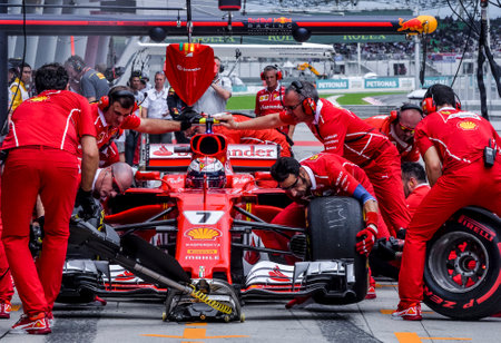 SEPANG, MALAYSIA : SEPTEMBER 30, 2017 : The Scuderia Ferrari team work on the car of Kimi Raikkonen...