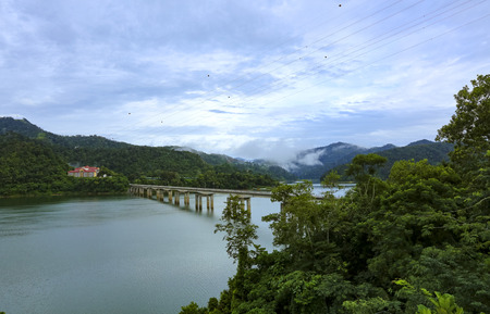 The peace environment and rainforest landscape of Royal Belum State Park reflected off the calm...