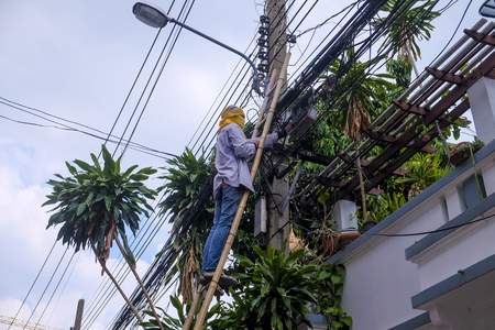 Electricity Worker fix problem at Bangkok, Thailand.の写真素材