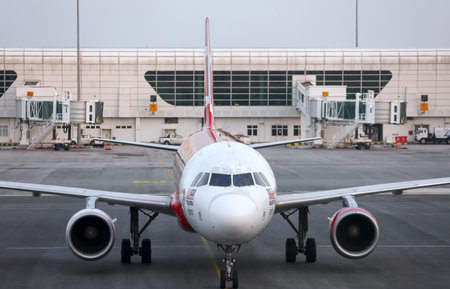 SEPANG, MALAYSIA - APRIL 17, 2019 : Air Asia Low Cost Airlines aircraft at Kuala Lumpur International Airport 2 (klia2). AirAsia operates scheduled domestic and international flights.のeditorial素材