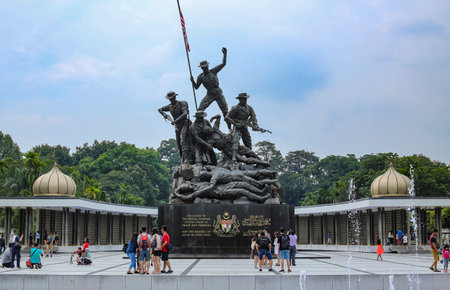 KUALA LUMPUR, MALAYSIA - JULY 21, 2018 : Local and tourist visiting Malaysia National Monument also known as Tugu Negara. This is one of iconic tourist attraction place.のeditorial素材