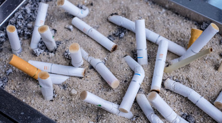 Cigarette filters or butts in ashtray.