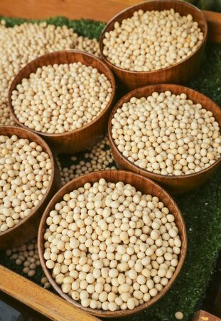Raw dried soybean or soya bean in wooden bowl.の写真素材