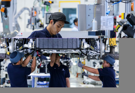KEDAH, MALAYSIA - JULY 04, 2019 : Workers at engine assembly plant. Catering for both the domestic and export markets. Automotive & technology.のeditorial素材