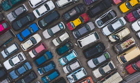 KUALA LUMPUR, MALAYSIA - SEPTEMBER 27, 2019 : Top view of unuse, unclaim, old damaged cars and other vehicle at junkyard waiting for recycling. Industrial scrap and transportation.のeditorial素材