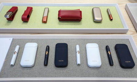 KUALA LUMPUR, MALAYSIA - OCTOBER 08, 2019 : Heating tobacco system IQOS by Philip Morris International. Electronic cigarette is new technology and alternative safe way in smoking.のeditorial素材