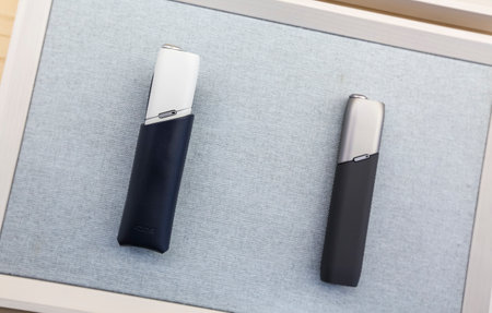 KUALA LUMPUR, MALAYSIA - OCTOBER 08, 2019 : Heating tobacco system IQOS by Philip Morris International. Electronic cigarette is new technology and alternative safe way in smoking.のeditorial素材