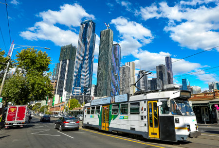 MELBOURNE, AUSTRALIA - MARCH 19, 2018 : The famous Melbourne Tram with the background of city center. Melbourne has the largest urban tramway network in the world. One of tourist attraction.のeditorial素材
