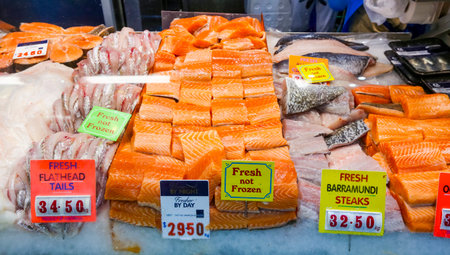 MELBOURNE, AUSTRALIA - MARCH 15, 2018 : Fresh salmon fish at tourist attraction place, Queen Victoria Market. Wet market for meat and seafood.のeditorial素材