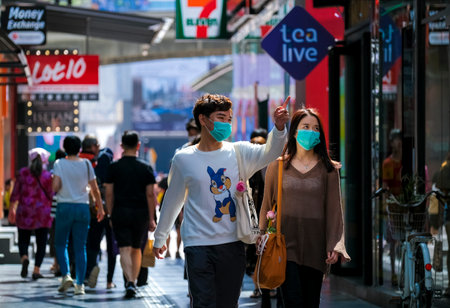 KUALA LUMPUR, MALAYSIA - FEBRUARY 22, 2020 : People wearing face mask to prevent infection of virus at Bukit Bintang. Bukit Bintang is a famous tourist attraction place.のeditorial素材
