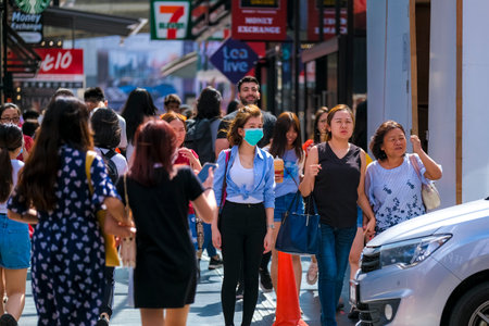 KUALA LUMPUR, MALAYSIA - FEBRUARY 22, 2020 : A woman wearing face mask to prevent infection of virus at Bukit Bintang. Bukit Bintang is a famous tourist attraction place.のeditorial素材