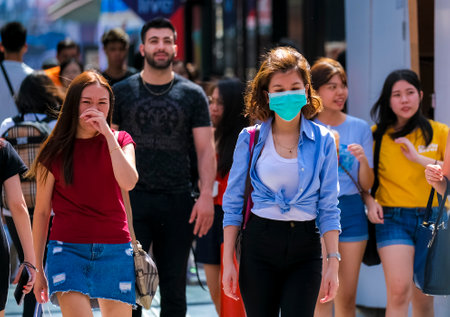 KUALA LUMPUR, MALAYSIA - FEBRUARY 22, 2020 : A woman wearing face mask to prevent infection of virus...