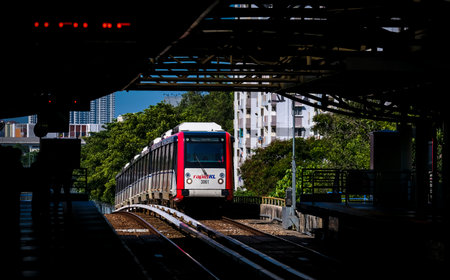 KUALA LUMPUR, MALAYSIA - FEBRUARY 21, 2020 : Malaysia Light Railway Transit (LRT) train operated by Rapid Rail or RapidKL. People commute with LRT as transportation to work, travel and shopping.のeditorial素材